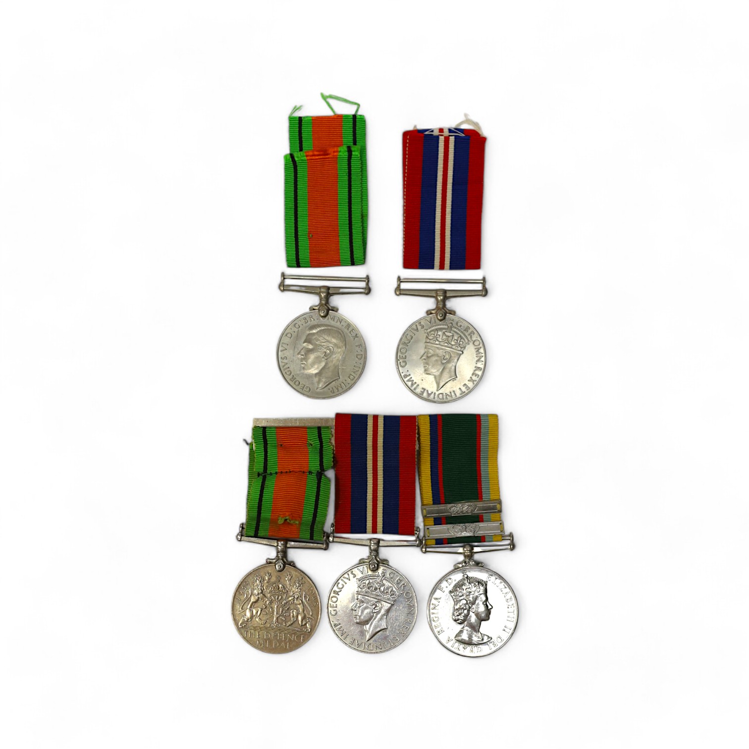 A group of assorted medals; WW2/ERII Cadet Forces medal group of 3 with two clasps to Fg.Off.W.K.Winstone R.A.F.V.R.(T); ERII RAFLSGC to Cpl B.K.Stockwell (F2570477) in box; WW2 Dm & WM. Condition - fair to good.